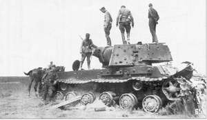 German soldiers examining hit KV-1 tank (with extra armor). Leningrad's Front, September 1941