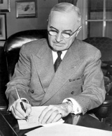 Truman signing national emergency proclamation, December 16, 1950