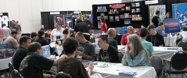 Gamers at the 2008 Origins Game Fair try out new games in the Dealers' Room.