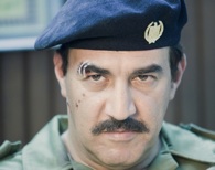 Saddam Hussein, portrayed by Igal Naor, after a narrow escape.