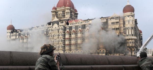 An Indian soldier aims his weapon toward The Taj Majal Hotel in Mumbai, Nov. 29, 2008. Indian commandos killed the last Islamic militants holed up inside the hotel, ending the more than two-day terror assault on India's financial capital. Pedro Ugarte/AFP/Getty Image.
