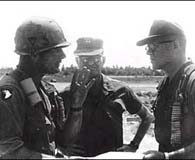 Col. David Hackworth (left) briefs Maj. Gen. Julian Ewell (right) near the Mekong Delta in 1969. (National Archives)