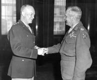 Eisenhower congratulates Montgomery after presenting him with the Distinguished Service Medal at SHAEF headquarters in June 1945. (National Archives)