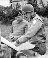 General Sir Bernard L. Montgomery, commanding general of the Allied Ground Forces in Normandy, is seen here with Lt. Gen. Omar Bradley, commanding general of the First U.S. Army, as they study a situation map in 1944. (National Archives)