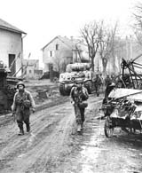 Men of the 378th Infantry Regiment enter the outskirts of Metz, France as Patton's Third U.S. Army continues its fighting in Lorraine. (U.S. Army Center of Military History)