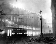 December 1941. A building burns in Sheffield, England, following a German raid during the Battle of Britain. National Archives.