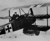 The historical Red Baron preparing for a flight over British lines in his Fokker Dr. I Triplane. National Archives.