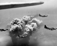 July 28, 1944. A high flying formation of 15th Air Force B-17 Flying Fortress bombers strike the Ploesti oil fields in Romania. (National Archives)