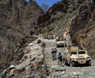 Soldiers prepare to walk to the remote village of Balik during a patrol in the rugged Titin Valley, Nuristan province, June 2007. Photo by Army Staff Sgt. Michael Bracken.
