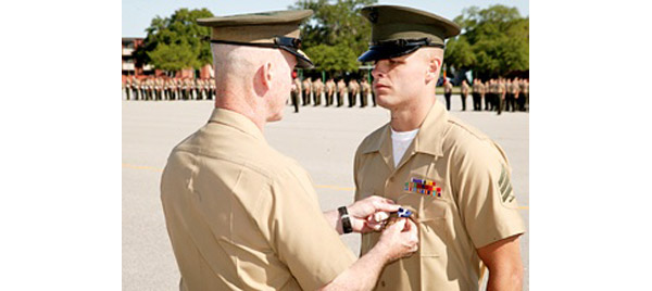 USMC Staff Sgt. Jeremiah Workman receiving the Navy Cross. Photo by Lance Cpl. Troy Loveless.