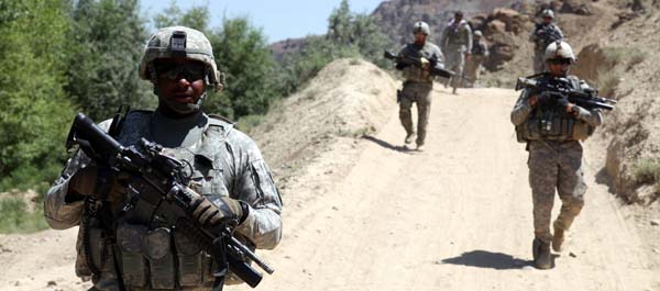 June 30, 2010. U.S. Soldiers assigned to the 401st Military Police Company, 720th MP Battalion, 89th MP Brigade patrol the village of Shaghasi Kala in Logar Province, Afghanistan. (Department of Defense) 