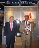 Robert Kraft, (left) the owner of the New England Patriots and Chairman and CEO of The Kraft Group, helps unveil “Pro Football and the American Spirit” on Saturday with Stephen Perry, President/Executive Director of the Pro Football Hall of Fame, who proudly displays an issue of Armchair General magazine. (Photo by John Ingoldsby)