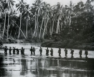September 1942: A Marine patrol crosses the Matanikau River on Guadalcanal. Click on photos for larger images. (National Archives)