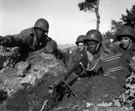 Nov. 20, 1950. Soldiers of the 2nd Infantry Division man a machine-gun position north of the Chongchon River. Click to enlarge. (National Archives)