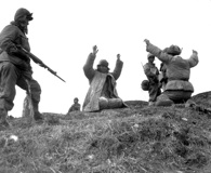 Mar. 2, 1951. Men of the 1st Marine Division capture Chinese soldiers following a battle on the central Korean front near Hoengsong. Click to enlarge. (National Archives)