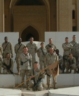 Then-Capt. D. A. Pryer (l ctr, behind guidon bearer) and 1st Sgt. Michael Quinn (r ctr, behind guidon bearer) with a portion of Bravo Company, 501st Military Intelligence Battalion, in front of Al Faw Palace, downtown Baghdad, Feb. 29, 2004. Click for larger image.