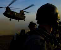 February 20, 2010. Members of an Afghan-international security force prepare to board a CH-47 Chinook after completing a mission in the Muhammad Aghah district, Logar Province, Afghanistan. (Army Sgt. Jordan Huettl)