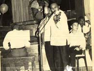 Victorio plays his violin in a family gathering (Family Collection)