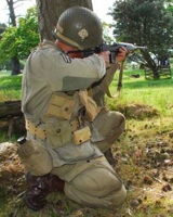 Drawing a bead while reenacting the 101st Airborne. Photo by Ade Pitman.