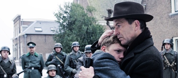 Thirteen-year-old Michiel Van Beusekom (Martijn Lakemeier) and his father (Raymond Thiry) embrace in 'Winter in Wartime.' Courtesy Sony Pictures Classics.