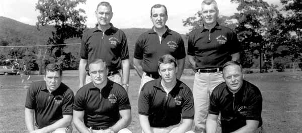 Parcells (kneeling, second from right) with his fellow West Point coaches including head coach Tom Cahill (standing, center). (Courtesy, U.S. Military Academy At West Point)
