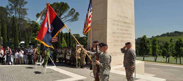 Soldiers of 10th Mountain Division serve as honor guard during a ceremony at the Florence American Cemetery in northern Italy. Nearly a thousand of the division's Soldiers were buried there during World War II, most were casualties of the fierce fighting in the nearby Apennine mountains. (Sgt. 1st Class John Queen)