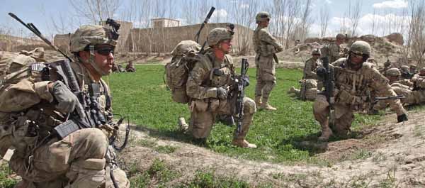 April 4, 2012. U.S. Army Soldiers assigned to the 141st Infantry Battalion, 3rd Infantry Combat Brigade, 1st Armored Division, provide security at a helicopter landing zone in Baraki Barak district, Logar province, Afghanistan. (Spc. Austin Berner)