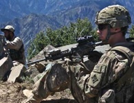 Pfc. Jeffrey Penning of Task Force Red Warrior (1st Battalion, 12th Infantry Regiment) and an Afghan Security Guard at OP Mustang. Photo by Army Sgt. Trey Harvey.