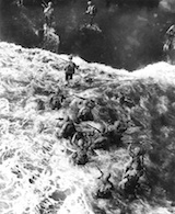 Marines wade ashore at Cape Gloucester. Click to enlarge.