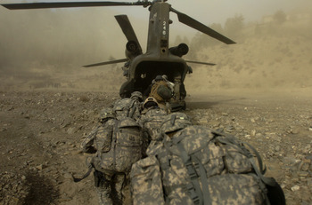 Soldiers from Delta Company, 2nd Battalion, 506th Infantry Regiment, Task Force Currahee, load up in a helicopter to head back to base after completing an operation near Spera in south-west Khowst province, Afghanistan, Nov. 21. During the operation they searched for weapons as well as search for key Taliban leaders within the area.
