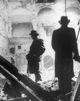 Winston Churchill in the ruins of the House of Commons debating room followng a German air raid in May 1941. Library of Congress.