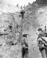 Rangers climbed rope ladders to scale the cliffs at Pointe du Hoc.