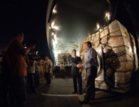 International press photograph of U.S. State Department special envoy Matthew Bryza and an unidentified man who greeted the first delivery of the U.S. - donated humanitarian supplies.