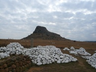 Whitewashed cairns marking the graves of the 24th Regiment dot the landscape of the Isandhlwana Battlefield. Erich Wagner.