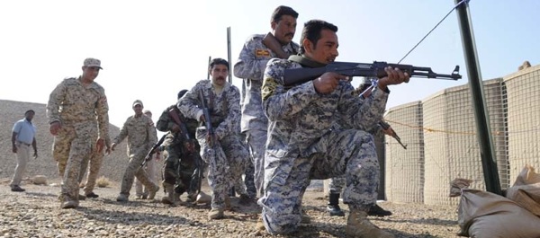 December 3, 2008. Iraqi policemen practice room-clearing procedures in a mock room at the Iraqi Police Academy on Forward Operating Base Delta in Al Kut, Iraq. The policemen attend a two-week refresher training course to help maintain the security of their city.Photo by Army Staff Sgt. Rasheen A. Douglas.