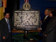 Kent Whitworth, executive director of the Kentucky Historical Society (left), Jerry Miller, former commissioner of the Kentucky Department of Parks, and Dr. Blaine Hudson, chairman of the Kentucky African American Heritage Commission, unveil marker.