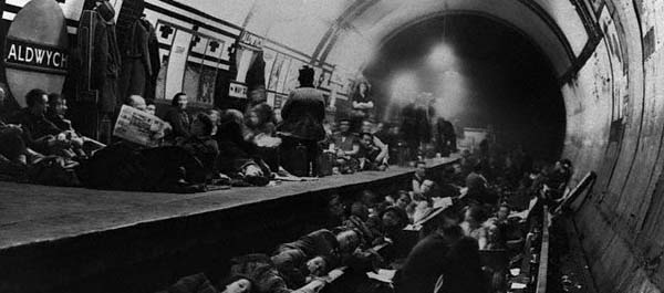 December 1940. Londoners sleep on the platform and tracks of an Underground station as they seek shelter from German Bombers during the Battle of Britain. (National Archives)