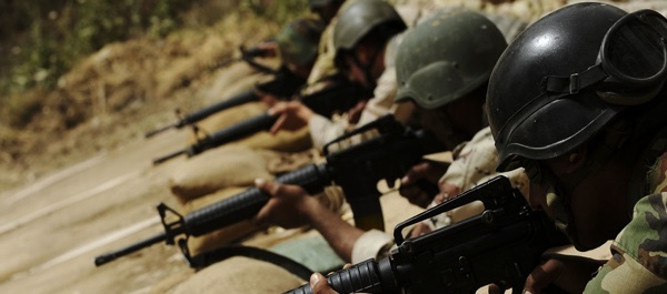 Iraqi soldiers fire during marksmanship training at Forward Operating Base Fortitude in the Faisaliah District of Mosul, Iraq, on May 5, 2009. U.S. Army Soldiers from the 12th Brigade, 3rd Iraqi Army Division, Military Transition Team provide Iraqi soldiers with the basics of marksmanship including weapons handling, weapons maintenance and proper breathing techniques. (Official U.S. Air Force Photo by Senior Airman Kamaile O. Chan)