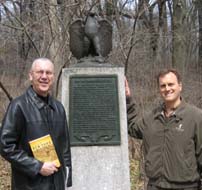 ACG publisher, Eric Weider (right) and Editor in Chief, Jerry Morelock, can attest from personal experience to the outstanding tour of the Revolutionary War Battle of Brooklyn that Barnet Schecter leads. This photo was taken at one of the monuments to the battle in Green-Wood Cemetery, Brooklyn, New York, during a tour Schecter led a few years ago.