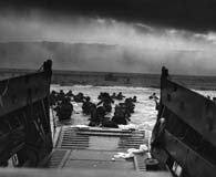 Troops of the 1st Infantry Division come ashore at Omaha Beach on D-Day. (National Archives)
