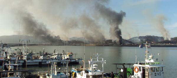 Houses on South Korea's Yeonpyeong Island burn from shells fired by North Korean Artillery on November 23, 2010. (STR/AFP/Getty Images)