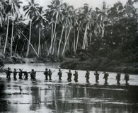 September 1942: A Marine patrol crosses the Matanikau River on Guadalcanal. Click on photos for larger images. (National Archives)