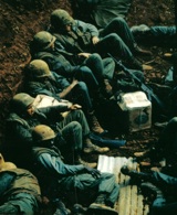 February 22, 1968, Marines wait for a C-123 to pick them up at Khe Sanh. National Archives.