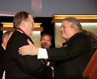 D'Este (left) receives the award from library founder James N. Pritzker (right) as last year's recipient, Rick Atkinson, looks on. (Scott Manning)