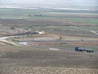 The area formerly the site of Ponte Olivo airfield, an important objective of the 1st Division. View from the commanding high ground of the Norman castle. One of the many Italian bunkers that guarded the airfield is at the left of the road. (Shirley D&rsquo;Este)