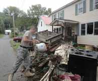 One of many Norwich University volunteers in Northfield. (Vermont Public Radio/Steve Zind)