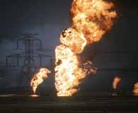 Oil well fires blaze out of control outside Kuwait City during Operation Desert Storm. (Department of Defense).