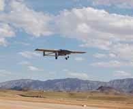 A TigerShark unmanned aerial vehicle descends to land at an undisclosed location in the U.S. Central Command area of operations following a mission June 4, 2011. A UAV was used to take out al Qaeda chieftain Anwar al-Aulaqi at the end of September. U.S. Navy photo.