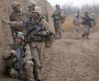 Marines of 3rd Battalion, 6th Marine Regiment, investigate a possible improvised explosive device while on a patrol in Afghansitan in 2010. U.S. Marine Corps Photo.