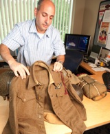 Chip Cifone, senior director of client technology services and support at ESPN, with his WWII memoribilia. Click to enlarge.